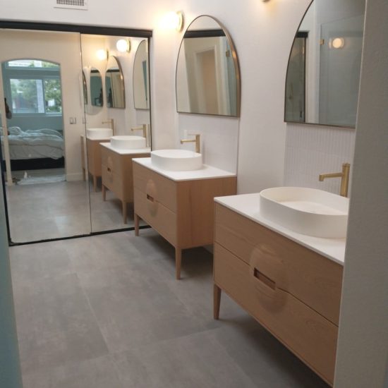 Fire Rebuild - bathroom - tub - bath tub - sink - table - taps - shower - wall - glass - toilet - tissue paper - window - mirror - frame - bottles - shampoos - igs construction